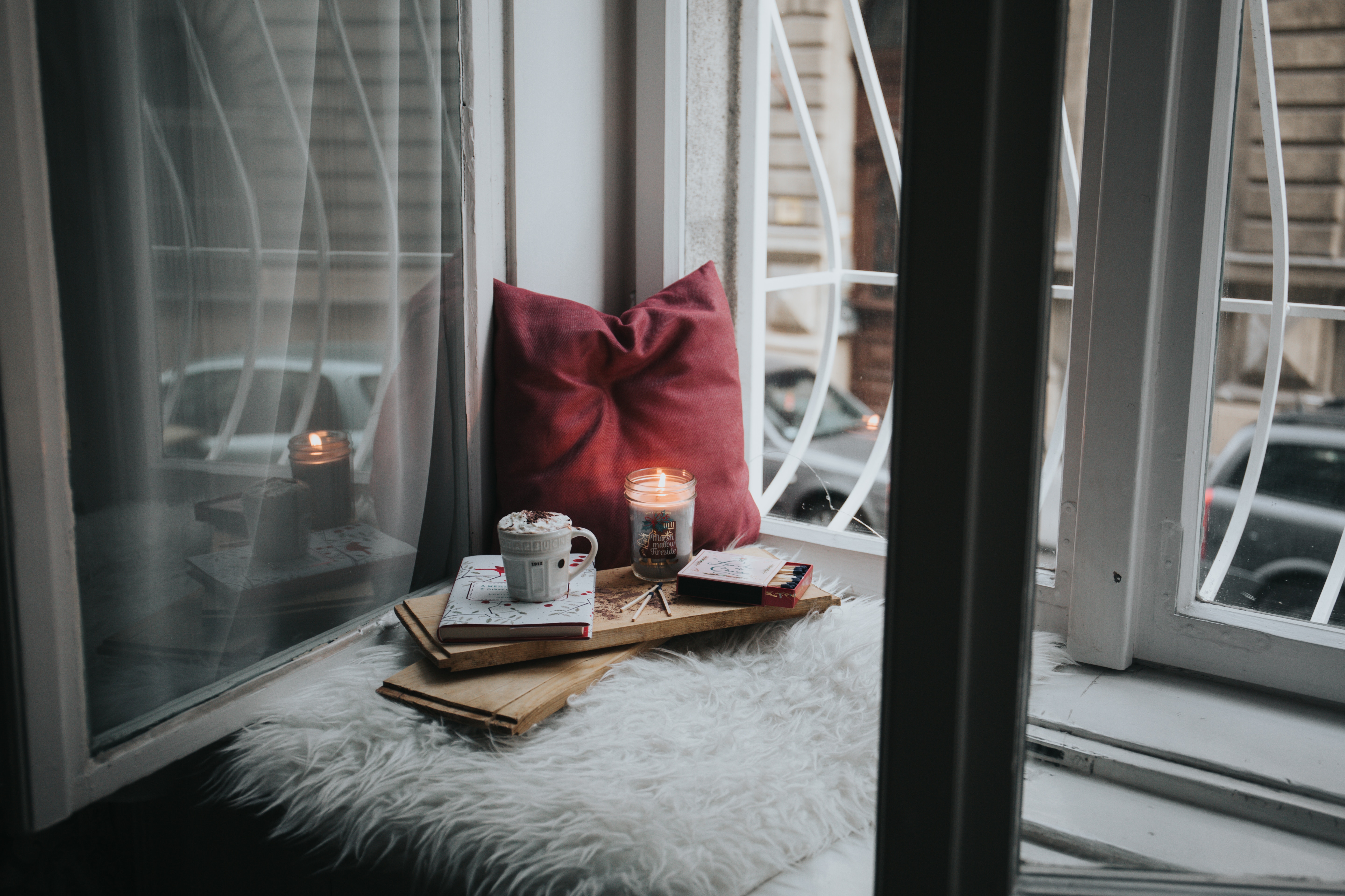 A cup of tea and books in a cozy corner